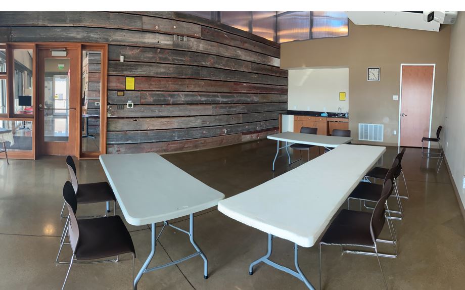 Bertram Library meeting room. Has 3 tables and 6 chairs available. As well as TV for presentations.